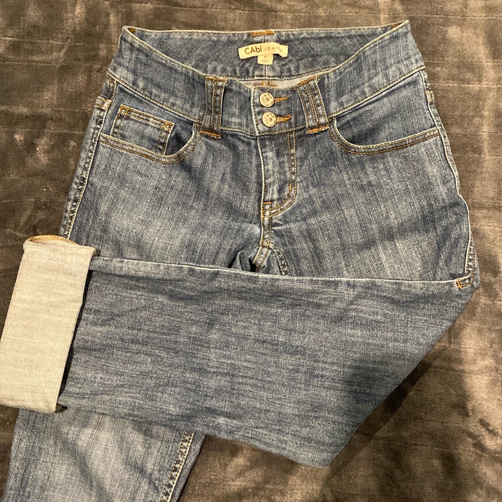 CAbi Mid-rise Straight Jeans with cute back pockets and double button closure